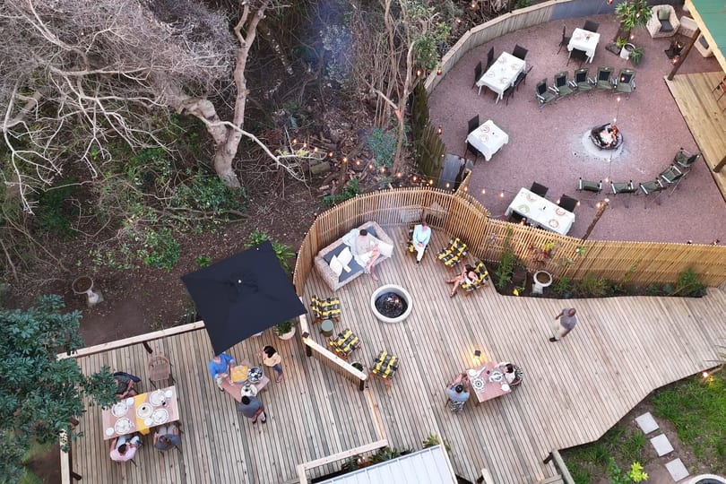 Looking straight down on the deck boma and main boma at dusk, smoke rising from the fires